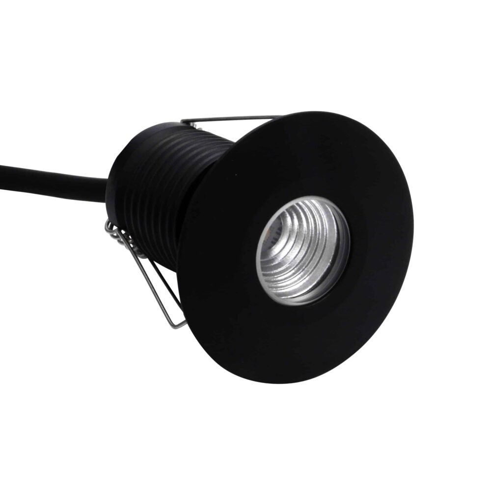 LuxR Modux Four Large Round Recessed Plug in black with its spring clips