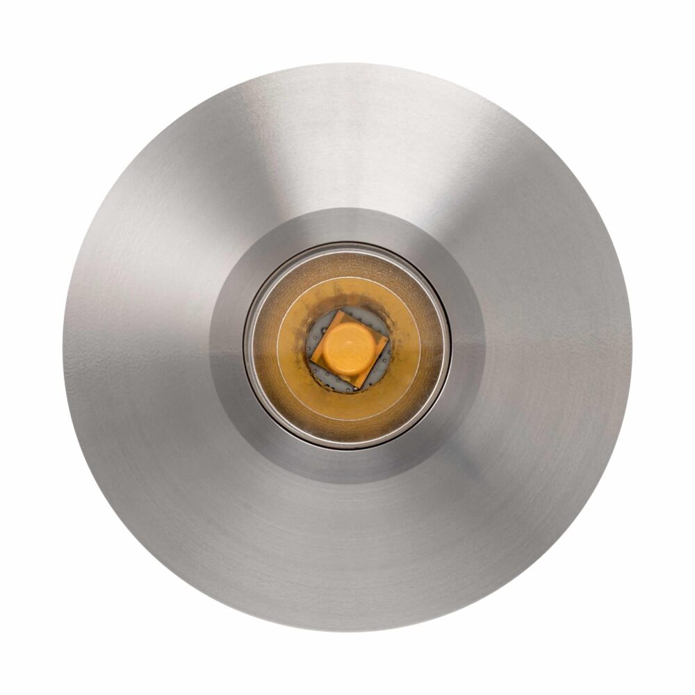 LuxR Modux Four Large Round in stainless steel seen face-on with its lens