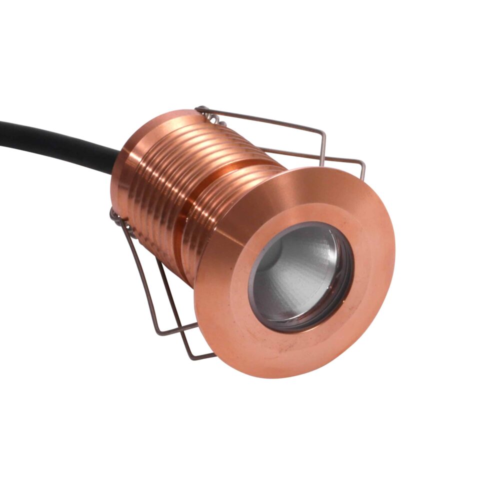 LuxR Modux Two Round Recessed Plug in solid copper with its spring clips
