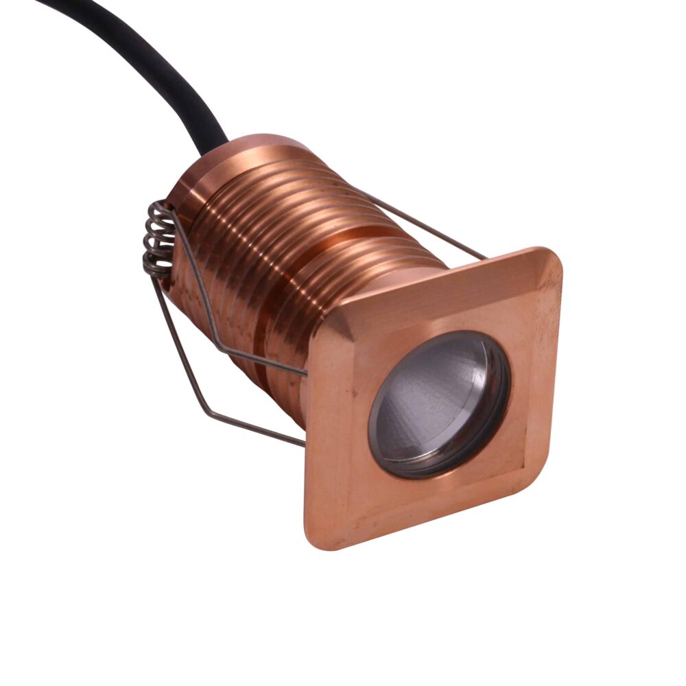 LuxR Modux Two Square Recessed Plug in solid copper with its spring clips
