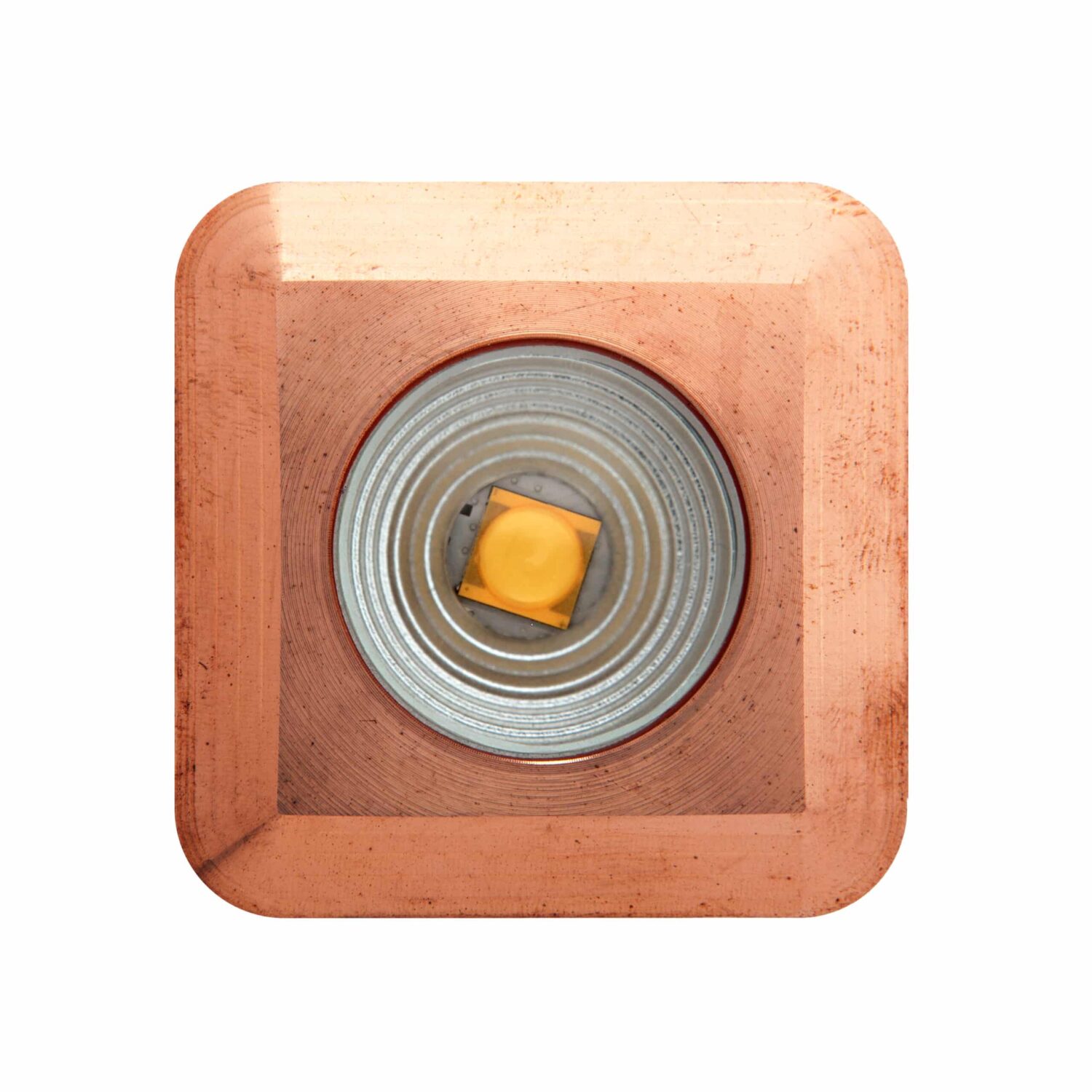 LuxR Modux Four Square in solid copper seen face-on with its LED
